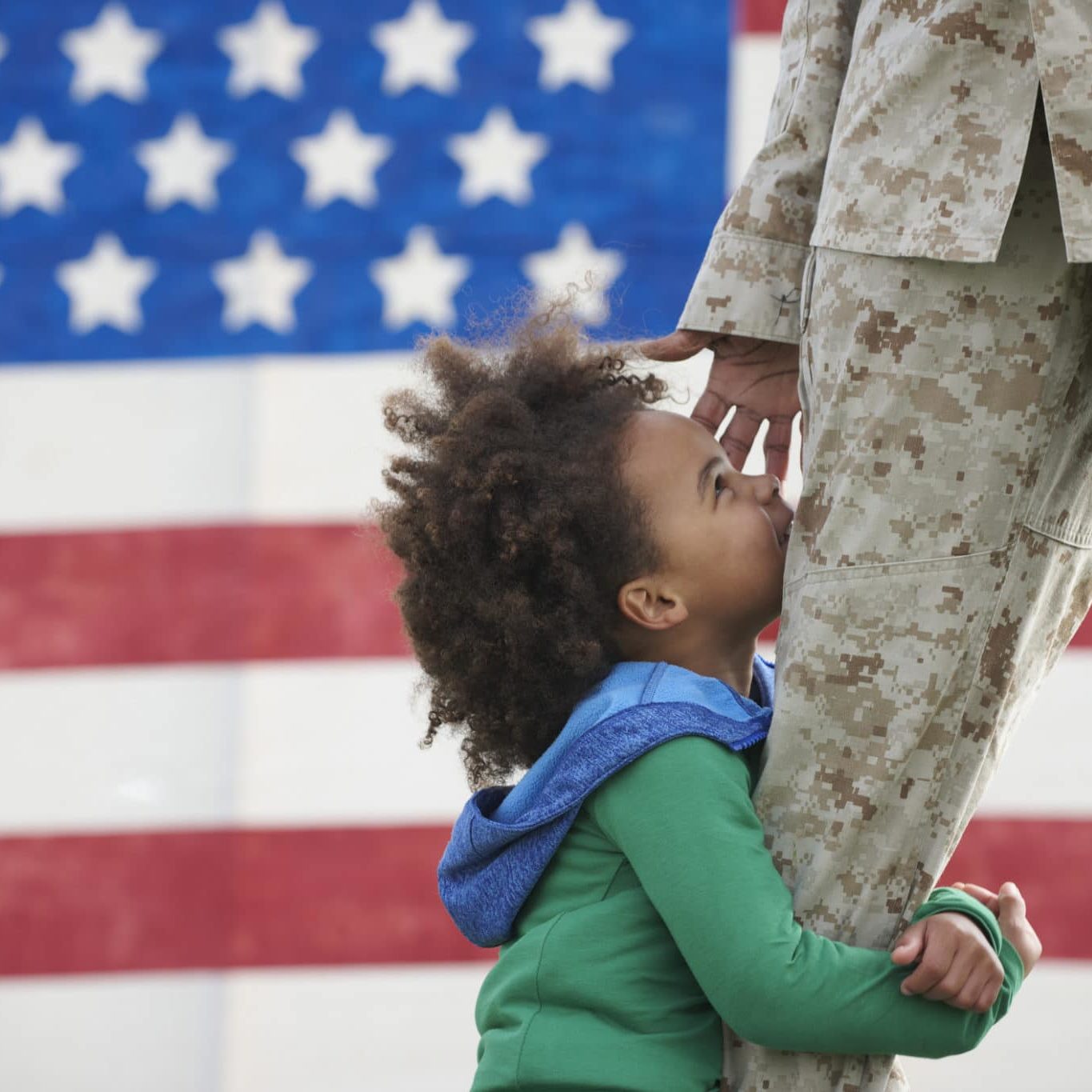Black Girl Hugging Leg Of Returning Soldier Black girl hugging leg of returning soldier