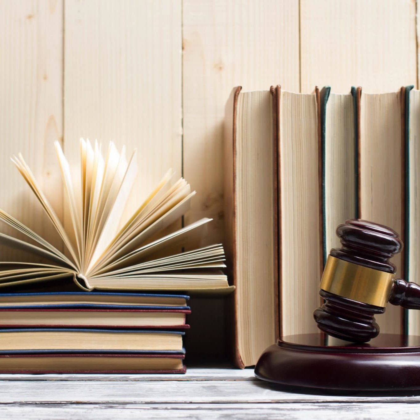 Legal Law Concept Open Law Book With A Wooden Judges Gavel On Table In A Courtroom Or Law Enforcement Office. Copy Space For Text Policies and Procedures