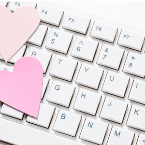Online Support Blog Two pink hearts on top of keyboard